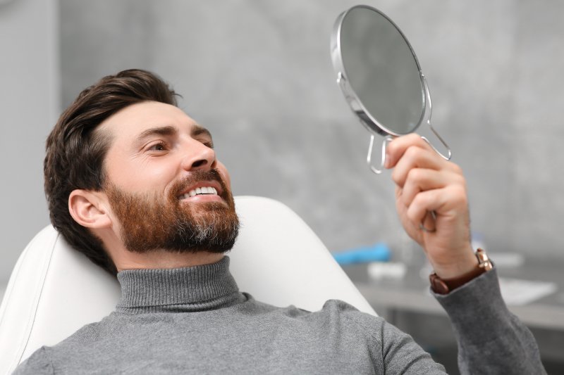 Patient smiling after getting dental fillings